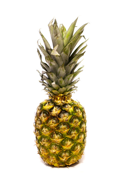 A beautifull juicy green pineapple on white background - Fotó, kép