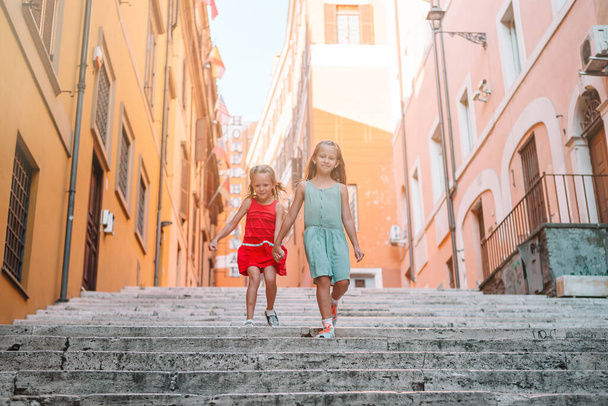 Adorable fashion little girls outdoors in European city - Photo, Image