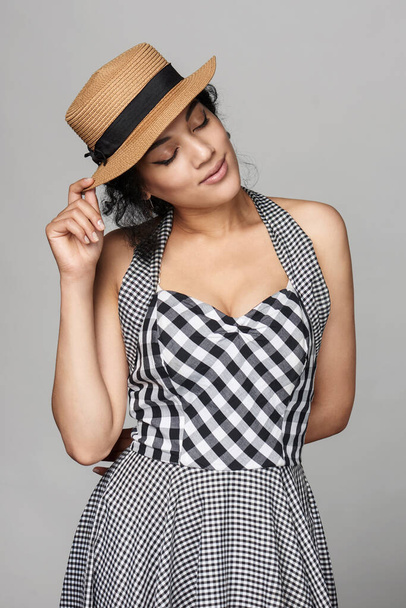 Romantic woman in chequered summer dress dreaming with closed eyes - Foto, Imagen