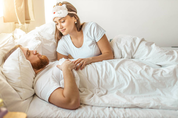 adorable caucasian woman look at sleeping man with love - Photo, image