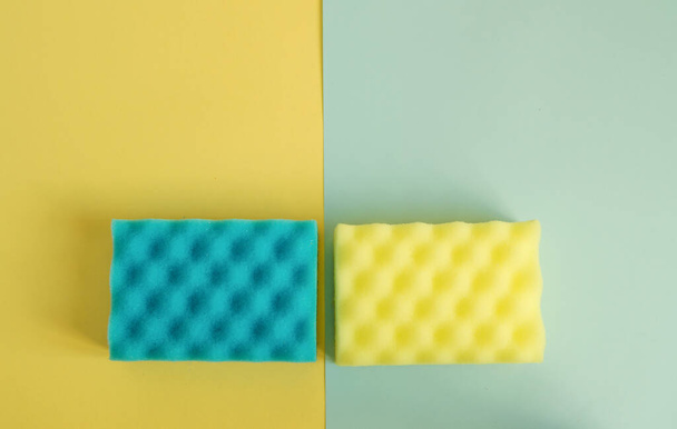 Kitchen and bathroom cleaning kit, yellow and blue sponges and rags, spring cleaning concept. - Foto, Imagen