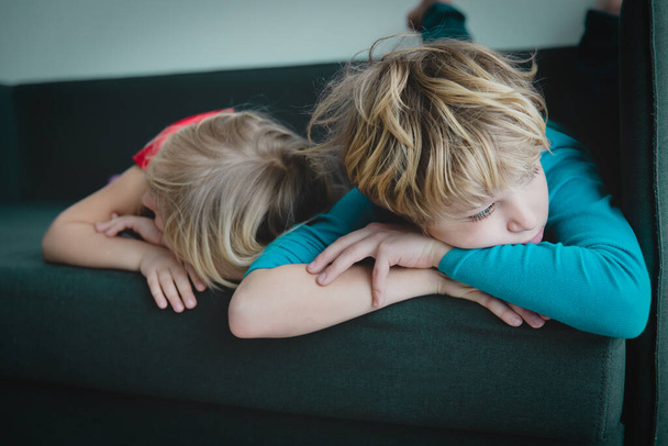 kids- boy and girl -bored staying home - 写真・画像