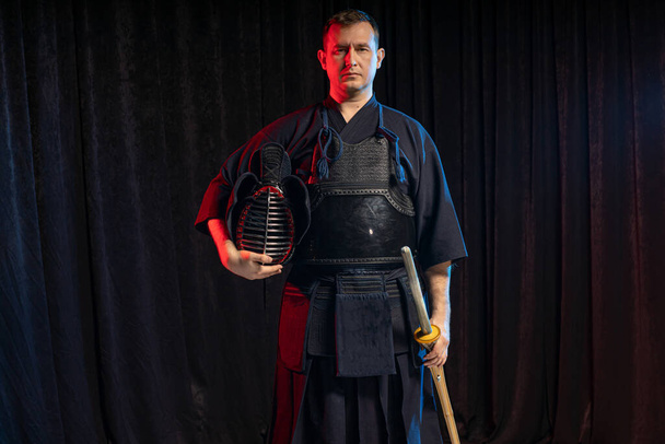 portrait of male kendo fighter with bokuto. protection concept - Foto, Bild