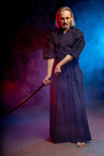 kendo warrior in traditional dress on smoky background - Photo, Image