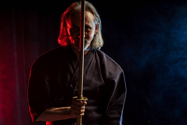 male kendo fighter with bamboo sword shinai - Fotoğraf, Görsel