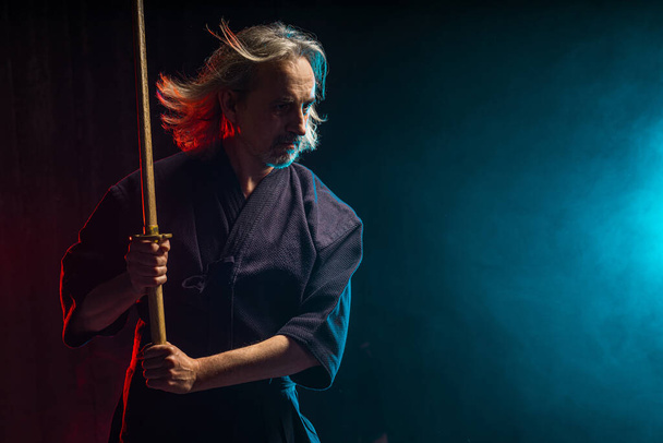 confident strong kendo warrior with shinai - Foto, imagen