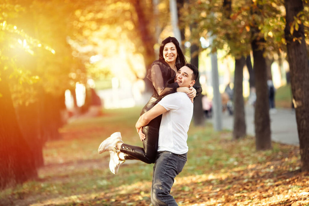 Smiling couple having fun in the park. Lviv. - Φωτογραφία, εικόνα