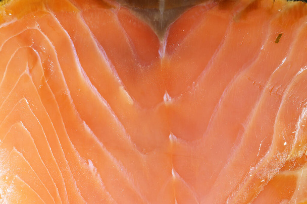 fotografía de una rebanada de salmón ahumado como fondo alimentario
 - Foto, imagen