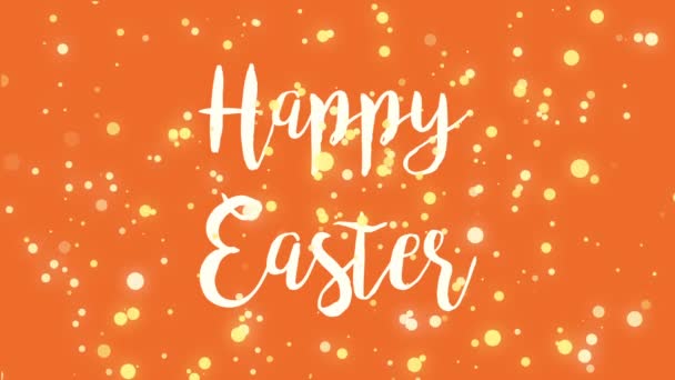 Vidám narancs Boldog Húsvéti üdvözlőlapot videó animáció kézzel írott szöveggel és csökkenő sárga fényrészecskékkel. - Felvétel, videó