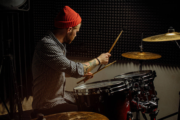 young man practicing play on drums before concert - 写真・画像