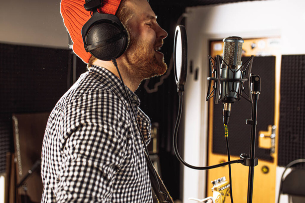 professional singer sing in recording studio - Fotó, kép