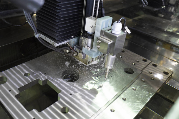 CNC wire cut machine cutting high precision mold parts - Photo, Image
