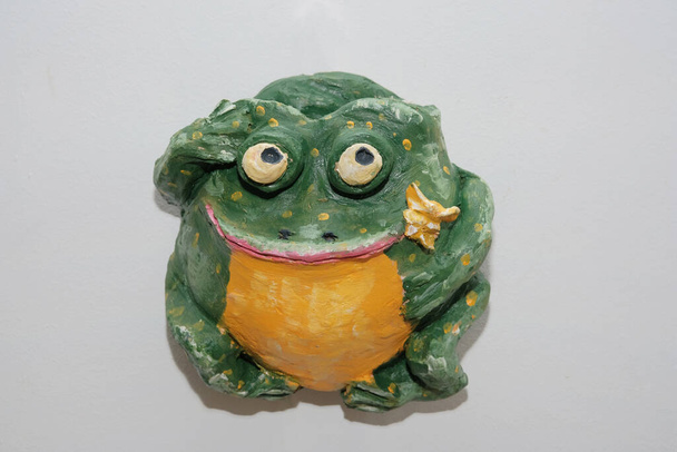 clay figurines of owls in scarfs and one of a frog - Photo, Image