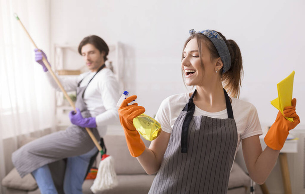 Playful Couple Having Fun While Cleaning Flat Together - Zdjęcie, obraz