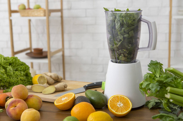 Blender with healthy smoothie and ingredients on table - Foto, Bild
