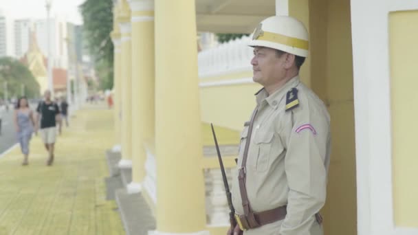 A male policeman in Phnom Penh, Cambodia, Asia - Felvétel, videó