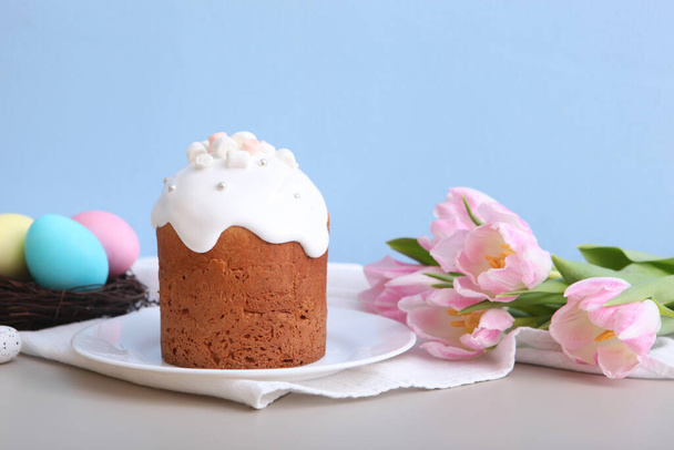 Traditional easter cake on the table. Traditional treats for Easter. Festive easter background. Place for text. Minimalism. - Zdjęcie, obraz