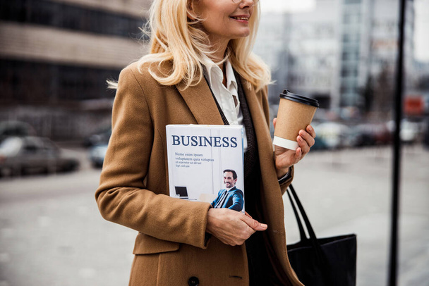 Cheerful middle-aged Caucasian business lady standing outdoors - Φωτογραφία, εικόνα