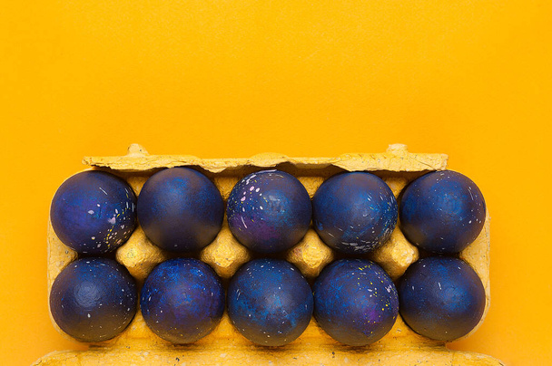 Blue eggs on a yellow background. trendy Easter egg of color of the year-classic blue, Top view. Flat lay. - Photo, Image