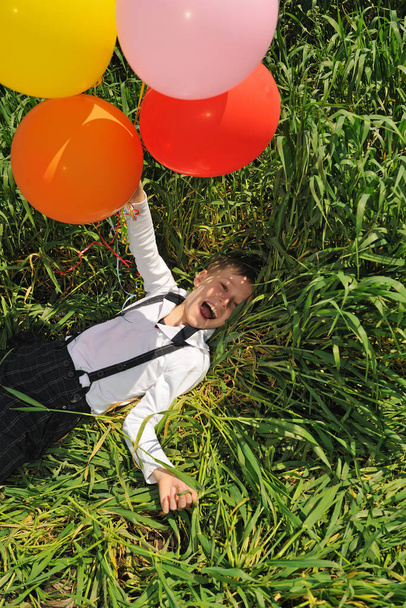 Happy boy with balloons outdoors - Photo, Image