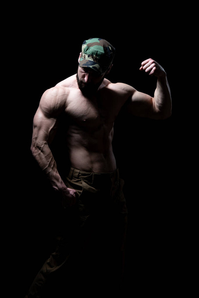 Young Bodybuilder Flexing Muscles - Isolate on Black Blackground - Copy Space - Foto, immagini