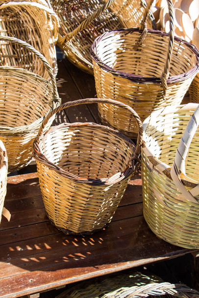 Empty wicker baskets are for sale in a market place - Photo, Image