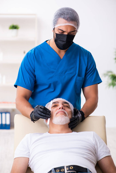 Old man visiting male doctor for plastic surgery - Photo, Image