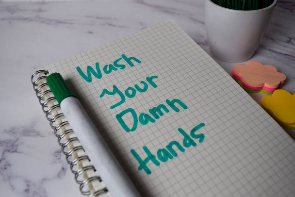 Wash Your Damn Hands write on a book and keyword isolated on Office Desk. Здравоохранение / Медицинская концепция
 - Фото, изображение