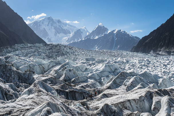 Passu glacier in surrounded by Karakoram mountain range, Gilgit Baltistan, Pakistan, Asia - Фото, изображение