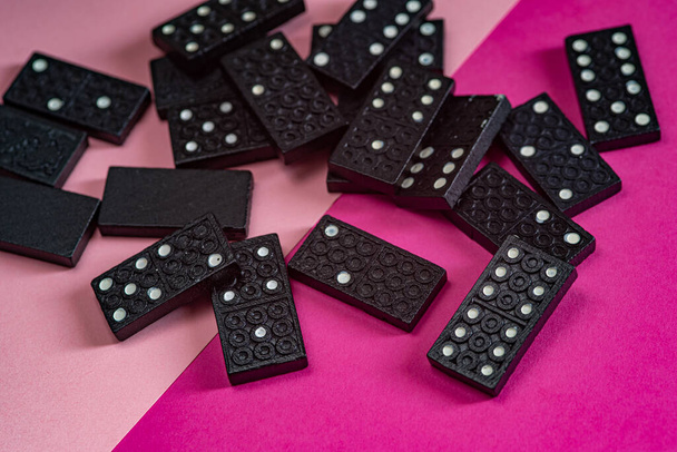 Black Dominoes game block on a colored background - Photo, Image