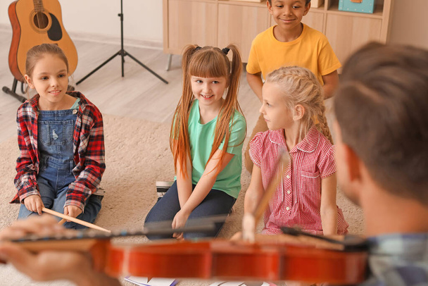 Cute little children at music school - Fotoğraf, Görsel
