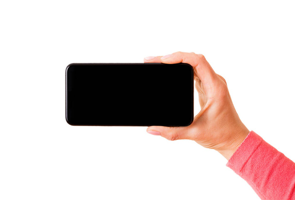Person holding smartphone horizontally, photo isolated on white background - Foto, Imagem