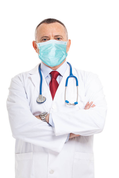 Portrait of a doctor wearing a mask isolated on white background - Foto, afbeelding
