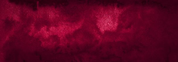 Dark saturated burgundy watercolor background with torn strokes and uneven spots. Trendy color texture. Abstract persian red background for design, layouts and patterns. - Photo, Image
