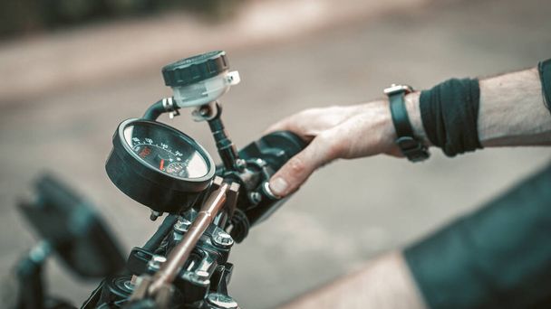 Male Hand Holding Wheel Of Motorbike Outdoors - Foto, Imagem
