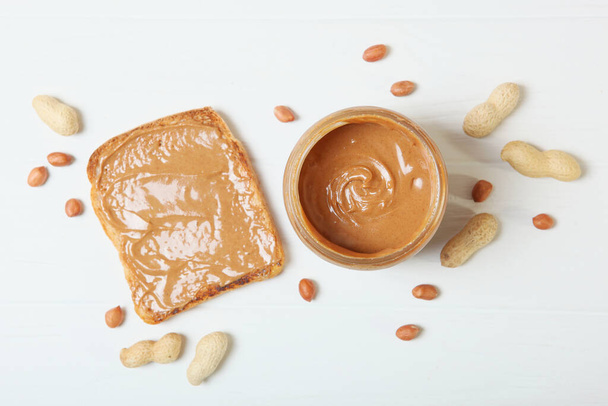 toast with peanut butter on the table. - Fotó, kép