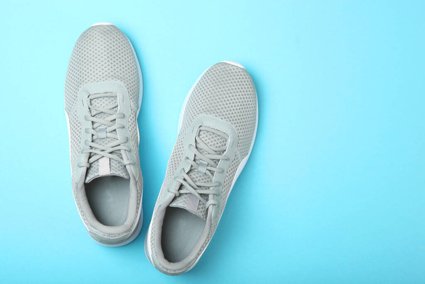 men's sneakers on a colored background top view. men's footwear. minimalism - Photo, Image