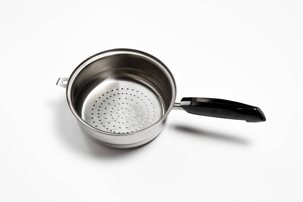 Stainless steel Colander on white background.Top view.High-resolution photo. - Photo, Image