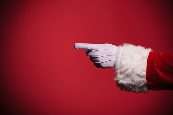 Santa Claus gloved hand pointing finger - Photo, Image
