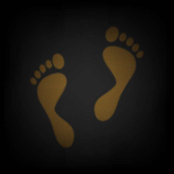 Foot prints sign. Icon as grid of small orange light bulb in darkness. - Vector, Image