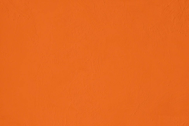 彩度の高いオレンジ色の低コントラスト粗さと凹凸のある具体的なテクスチャの背景。2020年、 2021年カラートレンド. - 写真・画像