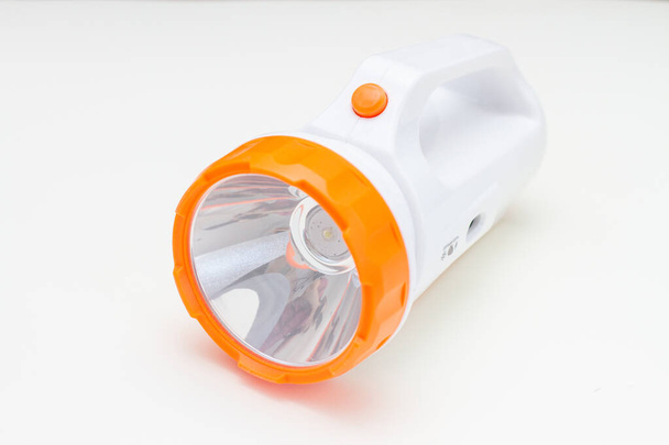 portable flashlight with LED lamp on a white background. - Photo, Image