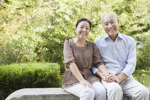 Senior Couple Sitting on a Bench - Photo, Image