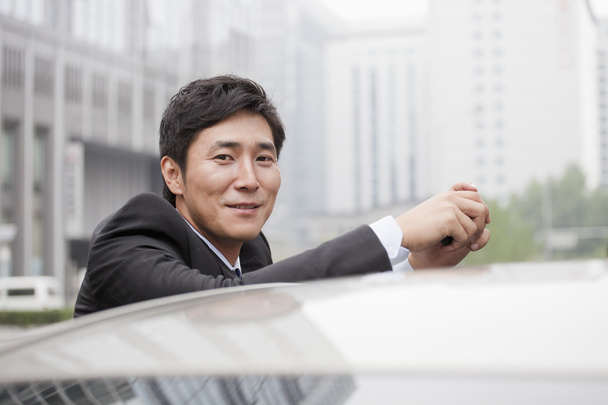 Businessman Leaning On Car - Photo, Image