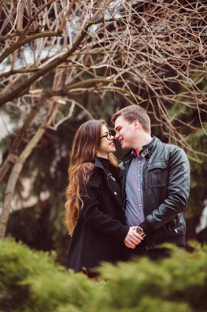 Lovers man and woman hugging outdoors - Valokuva, kuva