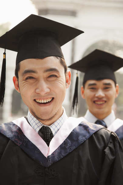 Young Graduates in Cap and Gown - 写真・画像