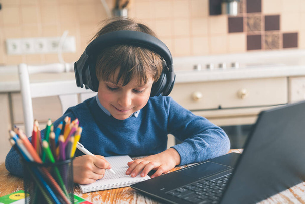Boy studying home online while school is closed - Φωτογραφία, εικόνα
