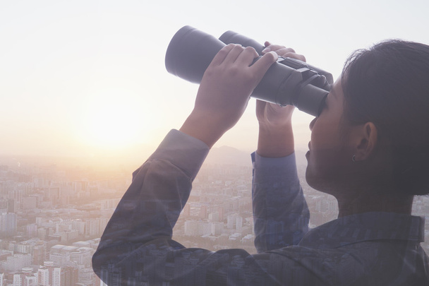 Businesswoman holding binoculars - Photo, Image