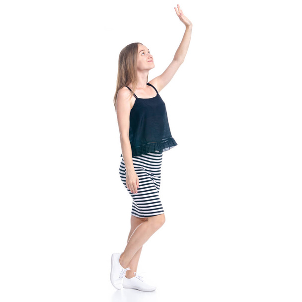 Woman in skirt smiling looking waving hand - Foto, Bild