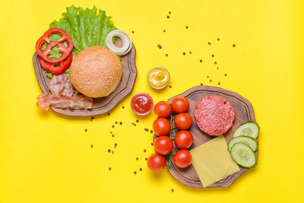 Ingredientes para hambúrguer saboroso em fundo de cor
 - Foto, Imagem